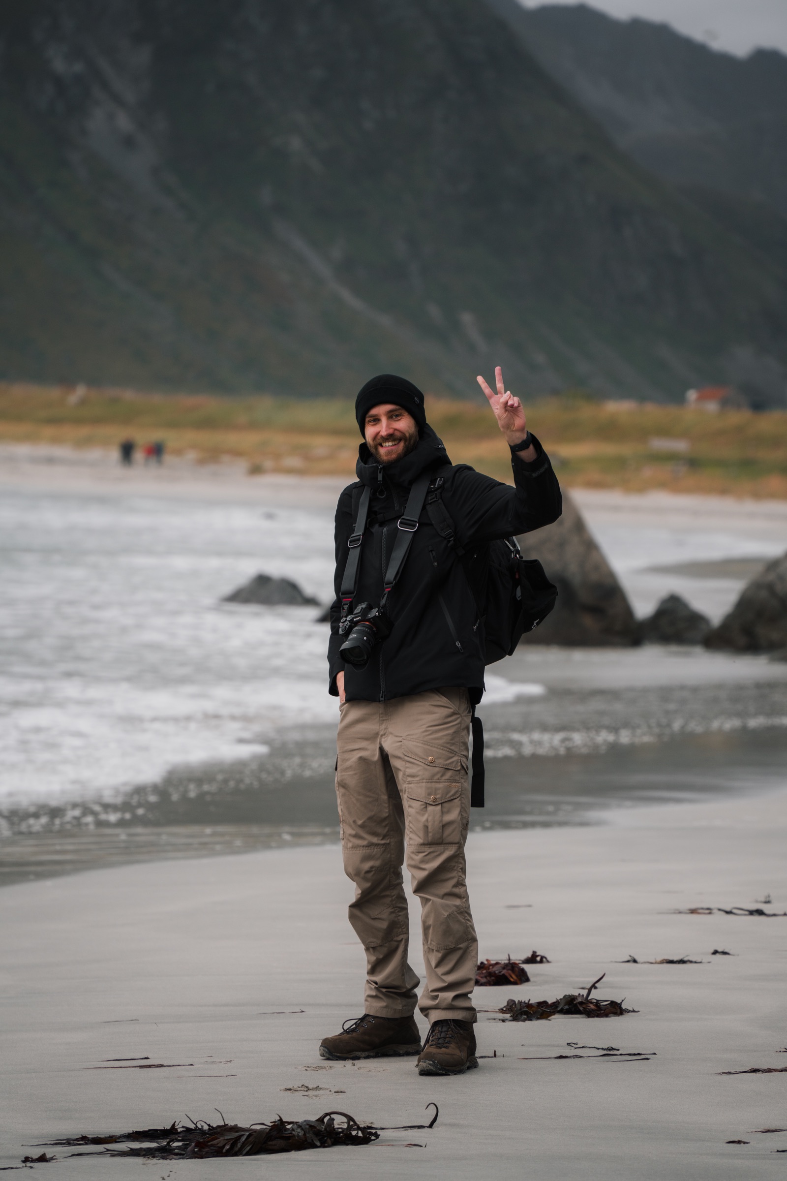 Tom Wagenaars standing on a beach in the Lofoten Islands