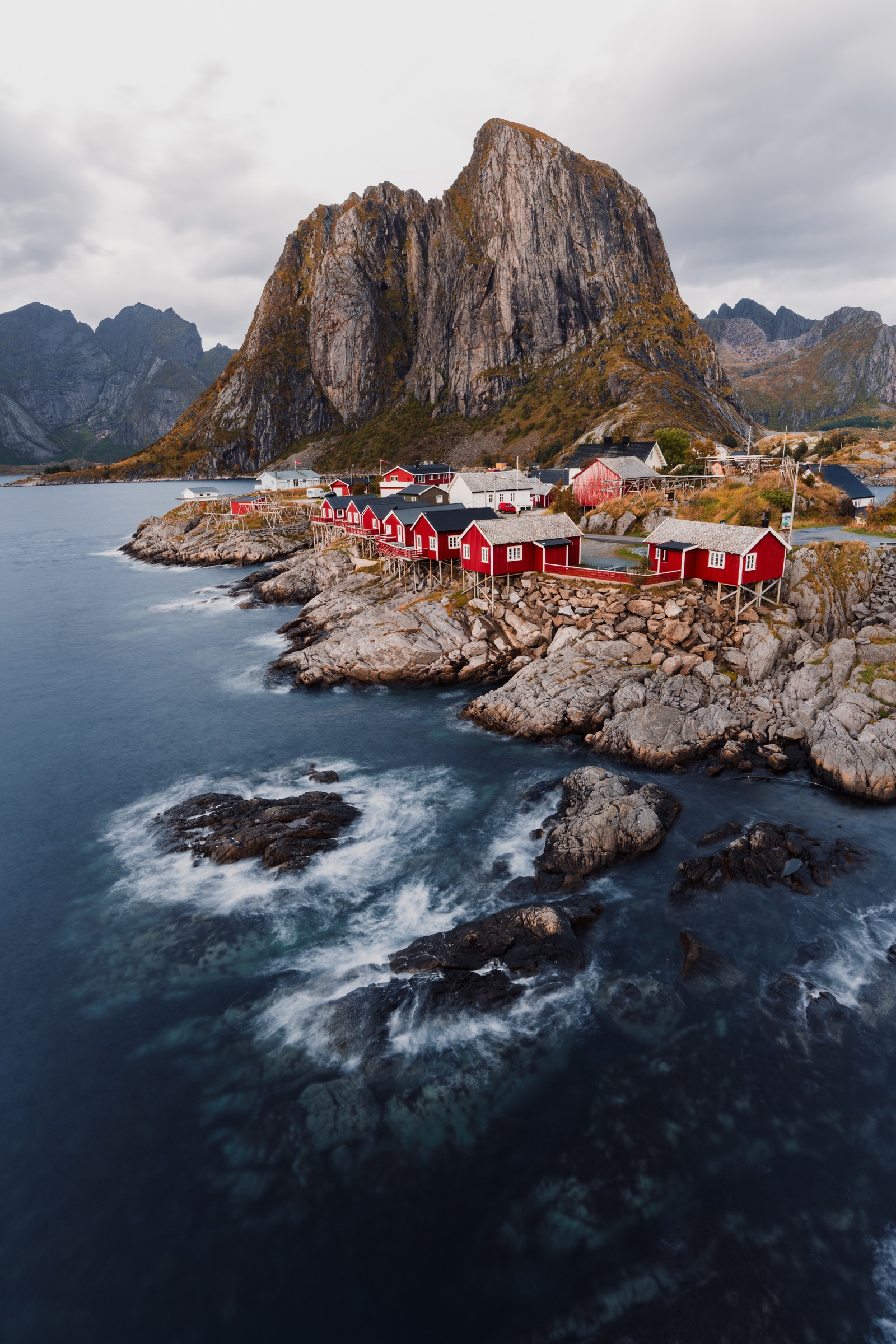 Fishing village surrounded by steep mountains and sea