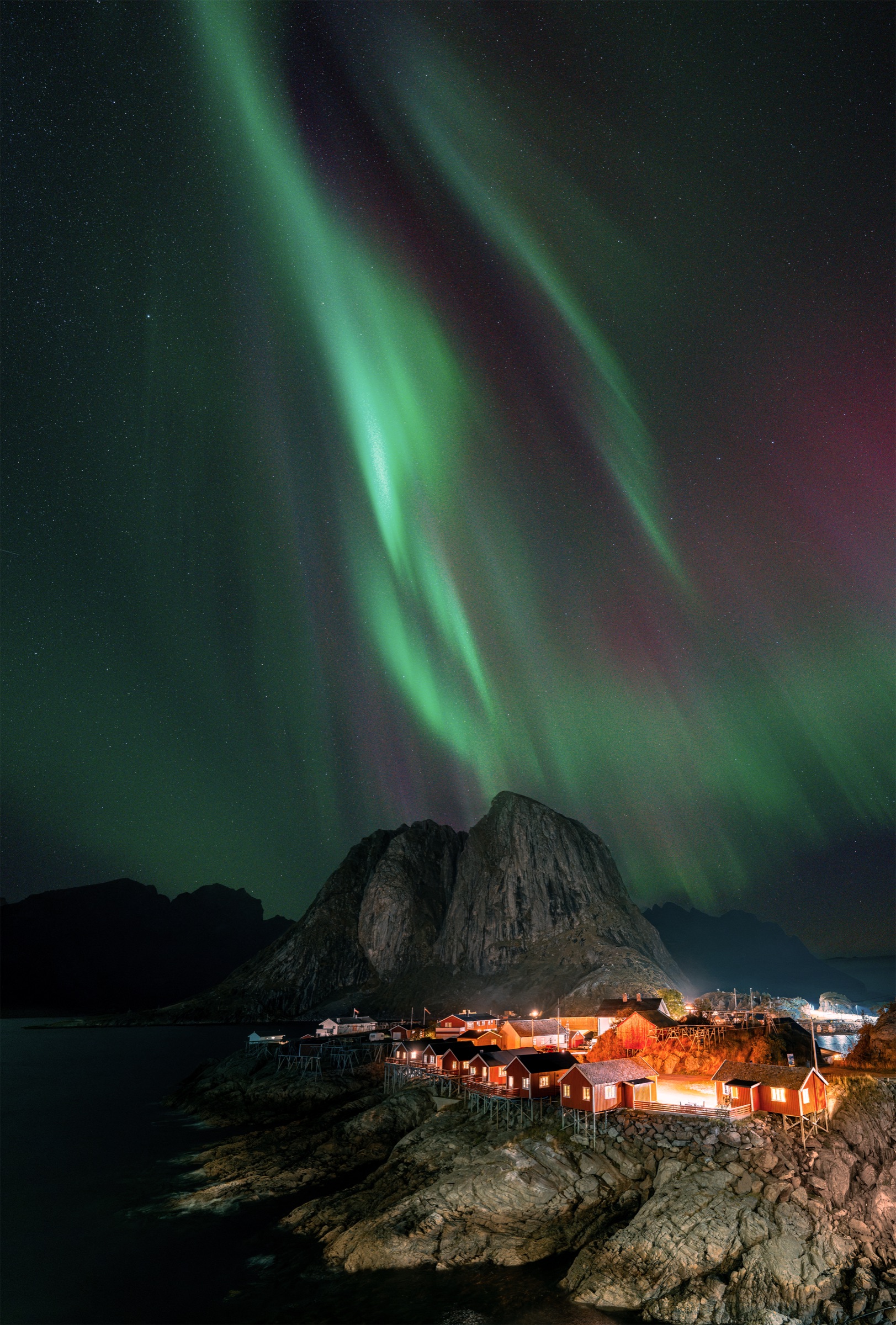 Northern lights above a fishing village in the Lofoten Islands