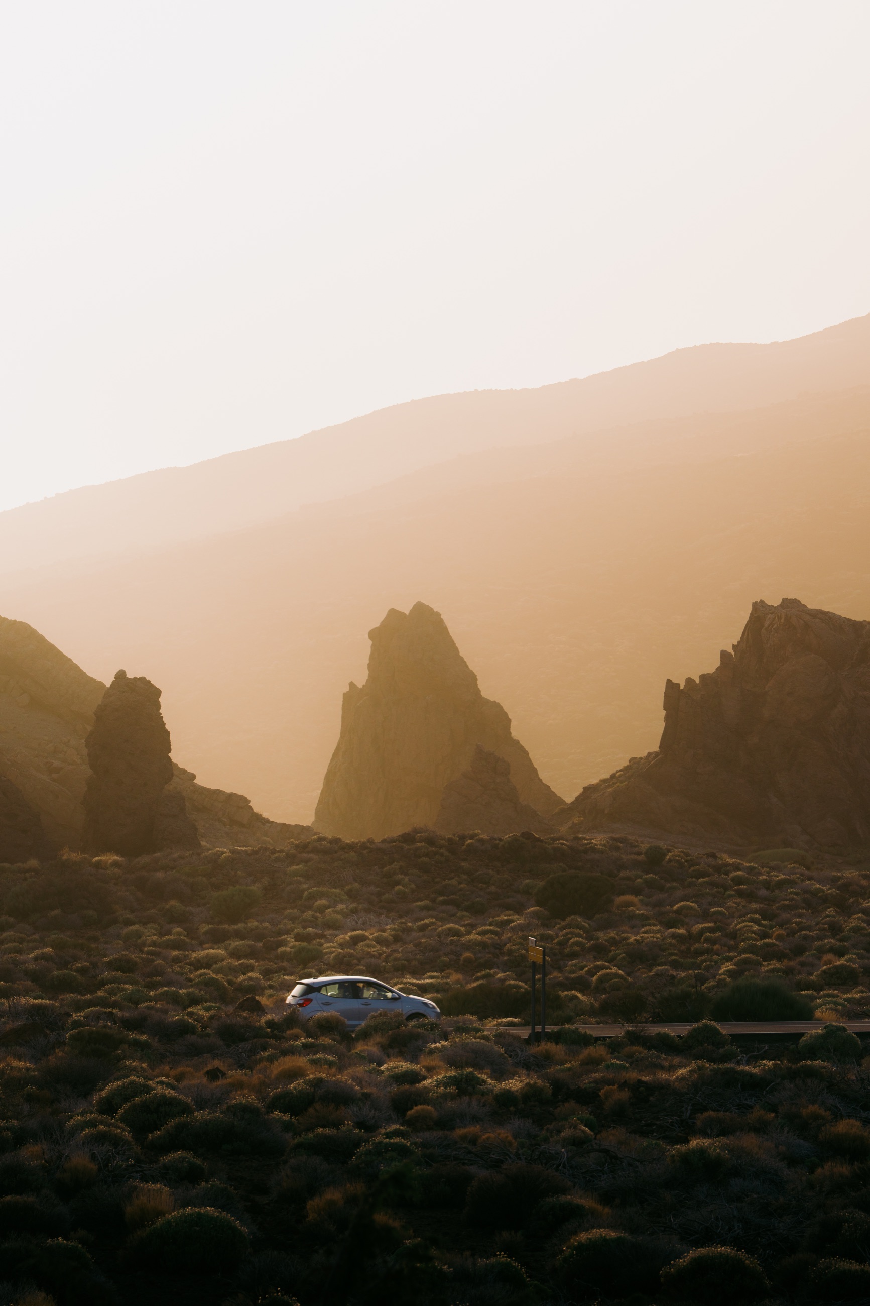 Golden evening light across rocky volcanic terrain in Tenerife